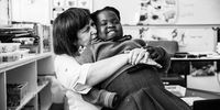 Hope at school with her teacher, Brenda Ben-David. Photographer: James Oatway