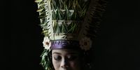 "The Rejang Dancer." In Bali, dancing is part of local traditions and religious ceremonies. One of the most beautiful dances is Rejang. Dressed in great costumes with headdresses, this dance is traditionally performed by young women at a ceremony in the inner courtyard of a temple. This dance is also one of the holiest sacrificial dances, performed to entertain visiting gods and spirits.<br> © Metha Meiryna, Indonesia, Winner, National Awards, Portraiture, 2022 Sony World Photography Awards