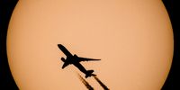 epa09888376 An Airbus A350 type passenger plane passes in front of the Sun in Vizslas, Hungary, 13 April 2022.  EPA-EFE/Peter Komka HUNGARY OUT