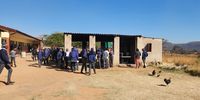 Children lining up at the school kitchen for their cooked lunch.  12 August 2024.   (Photo: Neesa Moodley)