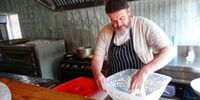 Charlie Lakin works his sourdough in his restaurant kitchen. He brought the ‘mother’ starter from Yorkshire going on eight years ago. (Photo: Wanda Hennig)<br>