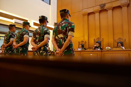 Indonesian military court jails four officers involved in acid attack on rights activist