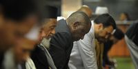 President Cyril Ramaphosa prays with members of the Muslim Judicial Council in Cape Town on 30 May 2018. Photo by Jaco Marais, Netwerk24