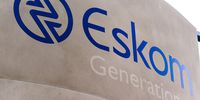 A company logo is displayed on a sign outside the Eskom Holdings SOC Ltd. Grootvlei coal-fired power station in Mpumalanga, South Africa, on Wednesday, Aug. 7, 2019. Eskom, South Africas biggest polluter, said emissions of particulate matter that cause chronic respiratory disease are at their highest level in two decades as the state power utilitys financial meltdown has seen it skip maintenance and has triggered strikes. Photographer: Waldo Swiegers/Bloomberg via Getty Images
