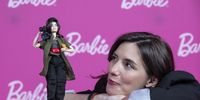 Mexican director Lila Aviles poses next to a Barbie doll in her image, during an interview with EFE, in Mexico City, Mexico, 09 March 2024 (Issued 12 March 2024). Mexican director Lila Avilés joins the list of inspiring women that Mattel honors with the 'barbie role models'. With a camera in hand, a clapperboard and even her cat, the doll celebrates the filmmakers: 'What better way to honor the craft?' Aviles tells EFE.  EPA-EFE/Isaac Esquivel