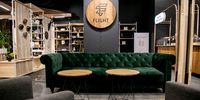 My first place of choice has become the long, forest green velvet sofa at Flight. (Photo: Supplied)<br>