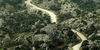 A car drives along a winding road on the slopes of Mount Pantokrator on February 5, 2010 in Corfu, Greece. Mount Pantokrator is the highest point on the island at 906 meters.  (Photo by Dan Kitwood/Getty Images)