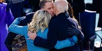 US President Joe Biden embraces his family First Lady Dr. Jill Biden, son Hunter Biden and daughter Ashley after being sworn in during his inauguation on the West Front of the U.S. Capitol on January 20, 2021 in Washington, DC. (Photo by Drew Angerer/Getty Images)