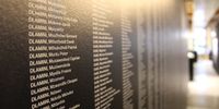 A wall filled with more than 19,000 names stands in the Truth and Reconciliation Commission (TRC) room at the Truth To Power: Desmond Tutu and the Churches in the Struggle Against Apartheid exhibition. They are the names of all those impacted by apartheid, as recoreded in the seventh volume of the TRC report. 14 March 2022. (Photo: Tamsin Metelerkamp)