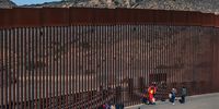 Migrants remain on one side of the border wall with the US, in Tijuana, Baja California, Mexico, 16 November 2022. EPA-EFE/JOEBETH TERRIQUEZ