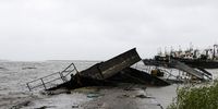 A damaged boat on the shore near Quelimane, as the storm Freddy hits Mozambique, 12 March 2023. (Photo: EPA-EFE / Andre Catueira) 
