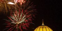 Fireworks light Muscat's sky behind the Sultan Qaboos grand mosque (Photo: Hamid al-Qasmi / EPA-EFE)