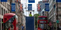 A police officer looks on from a raised viewing platform on Oxford Street as non-essential stores re-open for the first time since the nationwide lockdown came into force, on June 16, 2020 in London, United Kingdom. The British government have relaxed coronavirus lockdown laws significantly from Monday June 15, allowing zoos, safari parks and non-essential shops to open to visitors. Places of worship will allow individual prayers and protective facemasks become mandatory on London Transport.  (Photo by Dan Kitwood/Getty Images)