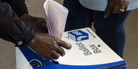 A voter cast their ballot paper into a ballot box at a polling station during the general election in Soweto, South Africa on Wednesday, May 8, 2019. (Photo: Waldo Swiegers/Bloomberg via Getty Images)