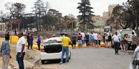 Bystanders inspect the bridge along Hospital Street that collapsed in the Boksburg tanker explosion on 26 December 2022. (Photo: Gallo Images / Fani Mahuntsi)