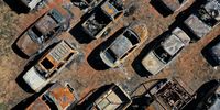 GREENVILLE, CALIFORNIA - SEPTEMBER 24: In an aerial view, cars that were destroyed by the Dixie Fire are visible on September 24, 2021 in Greenville, California. The Dixie Fire has burned nearly 1 million acres in five Northern California counties over a two month period. The destructive fire is the second largest fire in state history and has destroyed hundreds of structures. It is currently 94 percent contained. (Photo by Justin Sullivan/Getty Images)