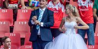 Freshly married couple spotted in the crowd in their wedding still clad in wedding paraphernalia during the Super Rugby match between Emirates Lions and Crusaders at Emirates Airline Park on April 01, 2018 in Johannesburg, South Africa. (Photo by Sydney Seshibedi/Gallo Images/Getty Images)