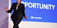 BIRMINGHAM, ENGLAND - OCTOBER 03:  British Prime Minister Theresa May dances as she walks out onto the stage to deliver her leader's speech during the final day of the Conservative Party Conference at The International Convention Centre on October 3, 2018 in Birmingham, England. Theresa May delivered her leader's speech to the 2018 Conservative Party Conference today. Appealing to the "decent, moderate and patriotic", she stated that the Conservative Party is for everyone who is willing to "work hard and do their best". This year's conference took place six months before the UK is due to leave the European Union, with divisions on how Brexit should be implemented apparent throughout.  (Photo by Jeff J Mitchell/Getty Images)