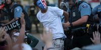 MINNEAPOLIS, MINNESOTA - MAY 31: A demonstrator is arressted during a protest against police brutality and the death of George Floyd, on May 31, 2020 in Minneapolis, Minnesota. Protests continue to be held in cities throughout the country over the death of George Floyd, a black man who died while in police custody in Minneapolis on May 25. (Photo by Scott Olson/Getty Images)