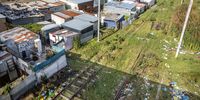 The railway line just before the train station in Khayelitsha, Cape Town, where families have set up informal settlements on the track. (Photo: Brenton Geach)