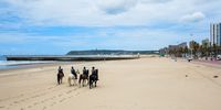 Mounted police during beach closures in Durban, South Africa on December 16, 2020. The beach promenade walk remained open however. Following new lockdown regulations given by president Cyril Ramaphosa on the 14th of December, there is a heavy police presence at Durban beaches to ensure that regulations are adhered to. (Photo by Gallo Images/Darren Stewart)