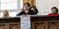 A supporter with a hand written sign for U.N. Special Rapporteur on Human Rights in the Occupied Palestinian Territories, Francesca Albanese who addressed a packed interfaith audience in the Groote Kerk in Cape Town on Sunday afternoon, 26 October 2025. (Photo: David Harrison)