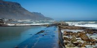 CAPE TOWN, SOUTH AFRICA - JANUARY 21: A general view of Camps Bay Tidal Pool on January 21, 2022 in Cape Town, South Africa. The tidal pool is one of the most popular tidal pools along the Atlantic Seaboard and it is a family-friendly place to swim and play. (Photo by Gallo Images/Misha Jordaan)
