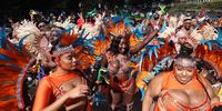 Performers in costumes take part in the Notting Hill Carnival in London, Britain, 28 August 2023. Notting Hill is the largest street carnival in Europe and a community-led celebration of Caribbean history and culture, this year running from 27 to 28 August.  EPA-EFE/NEIL HALL