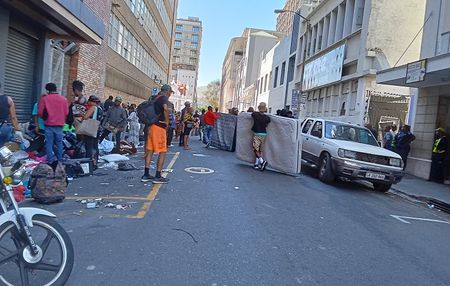 Hundreds of occupants evicted onto Cape Town streets from city centre buildings after court order