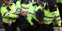 Police arrest a supporter of Palestine Action outside ACC Liverpool during the Labour Conference 2025 on September 28, 2025 in Liverpool, England. Labour Conference is being held against a vastly different backdrop to last year when the party had swept to power in a landslide general election victory. A year on and polling shows three quarters of Britons (74-77%) say they have little to no trust in the party on the cost of living, immigration, taxation, managing the economy, representing people like them, or keeping its promises. (Photo by Jeff Mitchell/Getty Images)