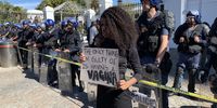 A protestor in front of the police line at the protest march against femicide and Gender Based Violence on 5 September 2019 outside Parliament in Cape Town. Photo: Anso Thom