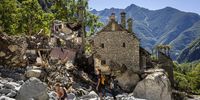 People inspect destroyed houses in Fontana, in Val Bavona in the Maggia Valley, southern Switzerland, 04 July 2024. Severe storms and torrential rain over the last weekend left five people dead in Switzerland's Val Maggia and its side valleys in Ticino.  EPA-EFE/MICHAEL BUHOLZER