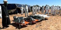 Rescuers stand near bodies of victims who died after Storm Daniel swept across eastern Libya. (Photo: EPA-EFE / Stringer)