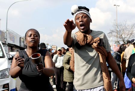 Police look on as anti-foreigner marchers vandalise businesses, join inspections