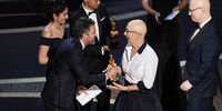 (L-R) Mark Ruffalo presents the Documentary - Feature - award for 'American Factory' to Julia Reichert and Steven Bognar onstage during the 92nd Annual Academy Awards at Dolby Theatre on February 09, 2020 in Hollywood, California. (Photo by Kevin Winter/Getty Images)