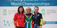 It's another gold for triathlon athlete Viv Williams (middle) as she beats the rest of the athletes in her age group at the 2012 world triathlon championships in Spain in the World Championships Long distance race. Left, Merce Magern Prat of Spain was second and Debra Kempe of Australia third.<br>(Photo: Supplied)