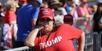 GOODYEAR, ARIZONA - OCTOBER 28: With few face masks and no social distancing to reduce the risk posed by the coronavirus, supporters wait for the arrival of U.S. President Donald Trump during a campaign rally at Phoenix Goodyear Airport October 28, 2020 in Goodyear, Arizona. With less than a week until Election Day, Trump and his opponent, Democratic presidential nominee Joe Biden, are campaigning across the country. (Photo by Chip Somodevilla/Getty Images)