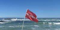 Red flags that indicate where people should not swim. (Photo: Supplied)