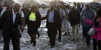 President Cyril Ramaphosa holds on to minister Mamoloko-Kubayi during his visit to Charlesville to witness the extent of the damage when the tailings dam of a nearby mine burst in Jagersfontein, 12 September 2022. (Photo: Felix Dlangamandla)