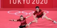 TOKYO, JAPAN - JULY 26: Ito Mima (L) and Jun Mizutani of Team Japan in action during their Mixed Doubles Gold Medal match on day three of the Tokyo 2020 Olympic Games at Tokyo Metropolitan Gymnasium on July 26, 2021 in Tokyo, Japan. (Photo by Ezra Shaw/Getty Images)