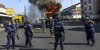 Firefighters try to extinguish a burning truck after it was  burnt and looted during the pro-Zuma protests in the CBD on 11 July 2021 in Durban, South Africa. (Photo: Gallo Images / Volksblad / Mlungisi Louw)