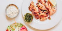 Grilled chilli-garlic Patagonian calamari with Peruvian coriander aji. (Photo: Amy Keevy)<br>