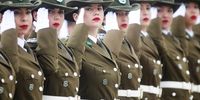 Female members of the Carabineros of Chile  salute as they march in a miliraty parade in the Parque O'Higgins in Santiago, Chile, 19 September 2023. The parade celebrates the 'Day of the glories of the Army' as part of the Chilean national holiday activities.  EPA-EFE/ESTEBAN GARAY