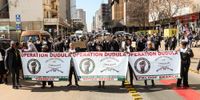 Operation Dudula supporters march to the Home Affairs offices on Harrison Street in Johannesburg on 7 July 2023. (Photo: Gallo Images / Fani Mahuntsi)
