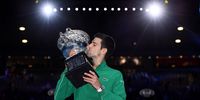 MELBOURNE, AUSTRALIA - FEBRUARY 02: Novak Djokovic of Serbia kisses the Norman Brookes Challenge Cup after winning the Men's Singles Final against Dominic Thiem of Austria on day fourteen of the 2020 Australian Open at Melbourne Park on February 02, 2020 in Melbourne, Australia. (Photo by Quinn Rooney/Getty Images)