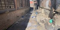 Residents of the building,  endure the stench of a dump inside the building. (Photo: Daily Maverick)