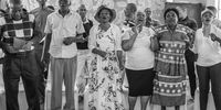 Past learners of Opang-Diatla singing at the reunion. Photo by Thom Pierce.