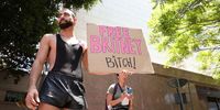 LOS ANGELES, CALIFORNIA - JUNE 23: (EDITORS NOTE: Image contains profanity.) #FreeBritney activists protest at Los Angeles Grand Park during a conservatorship hearing for Britney Spears on June 23, 2021 in Los Angeles, California. Spears is expected to address the court remotely.  Spears was placed in a conservatorship managed by her father, Jamie Spears, and an attorney, which controls her assets and business dealings, following her involuntary hospitalization for mental care in 2008. (Photo by Rich Fury/Getty Images)