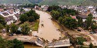 epa09348654 An aerial view taken with a drone shows a damaged bridge in Bad Neuenahr-Ahrweiler, Germany, 16 July 2021. Large parts of Western Germany were hit by heavy, continuous rain in the night to 15 July resulting in local flash floods that destroyed buildings and swept away cars.  EPA-EFE/FRIEDEMANN VOGEL