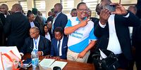 Tundu Lissu takes selfies with his legal team at the Kisutu Resident Magistrate’s Court on Monday. (Photo: Ikoti Lissu.)